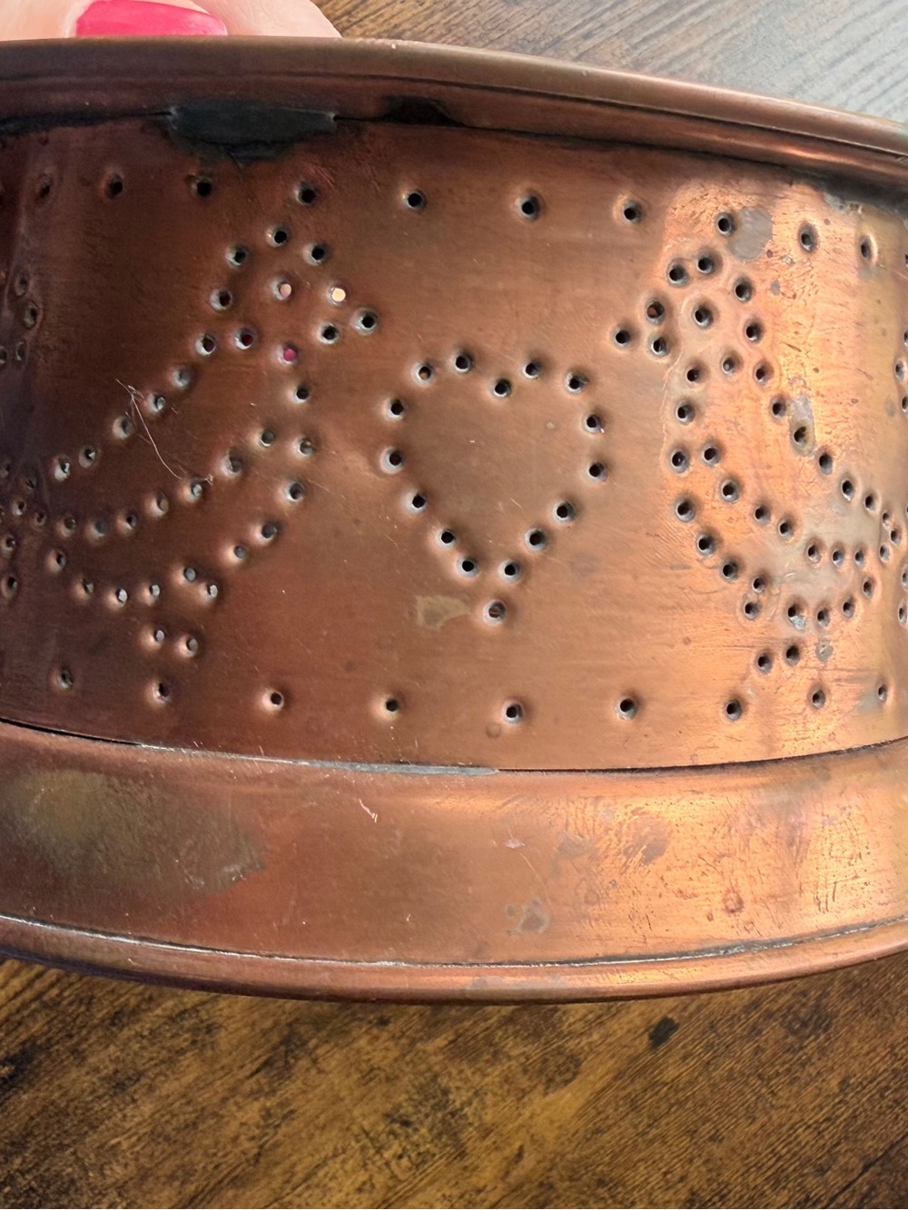 Vintage Pfaltzgraff Village punched copper votive candle warmer.